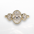 Oval Three Stone Bezel Ring